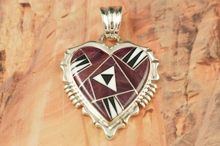 Genuine Purple Spiny Oyster Shell, Magnesite and Black Jade inlaid between ribbons of Sterling Silver. Free 18" Sterling Silver Chain with purchase of pendant. Stunning Heart Pendant Designed by Navajo Artist Rick Tolino. Signed. 